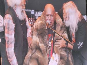 Singer-songwriter Archie Roach is honoured with a possum skin cloak at ‘Sharing the Spirit’ festival in Melbourne, 26 January 2021. Photo: Andrew Flynn