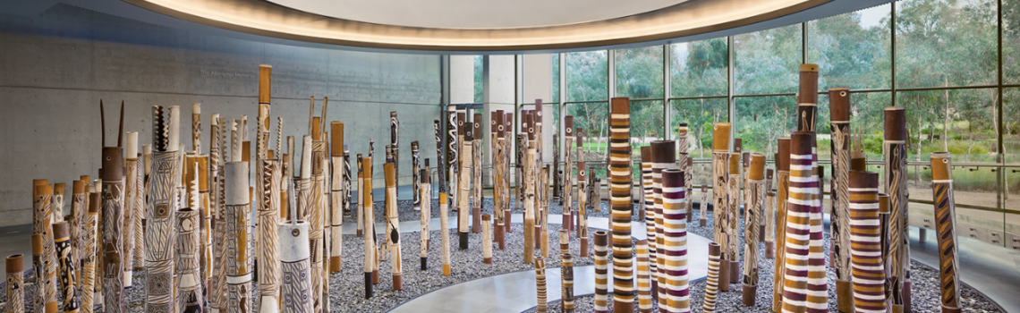 Memorial at the National Gallery in Canberra since 1988. Painted by 43 artists, mostly from the Ramingining area, it consists of 200 traditional hollow log coffins or 'dupuns' — one for each year of European settlement and representing the First Nations people who died defending their land and denied a proper burial.
Image provided by Ron Lawler